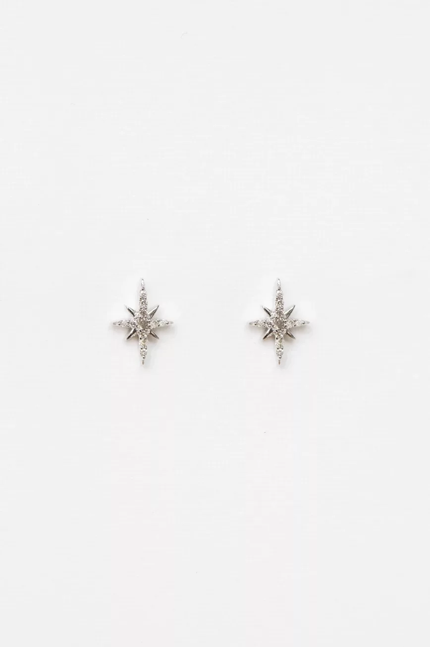 white gold stud earrings each featuring an eight-pointed north star pavé-set with round brilliant diamonds