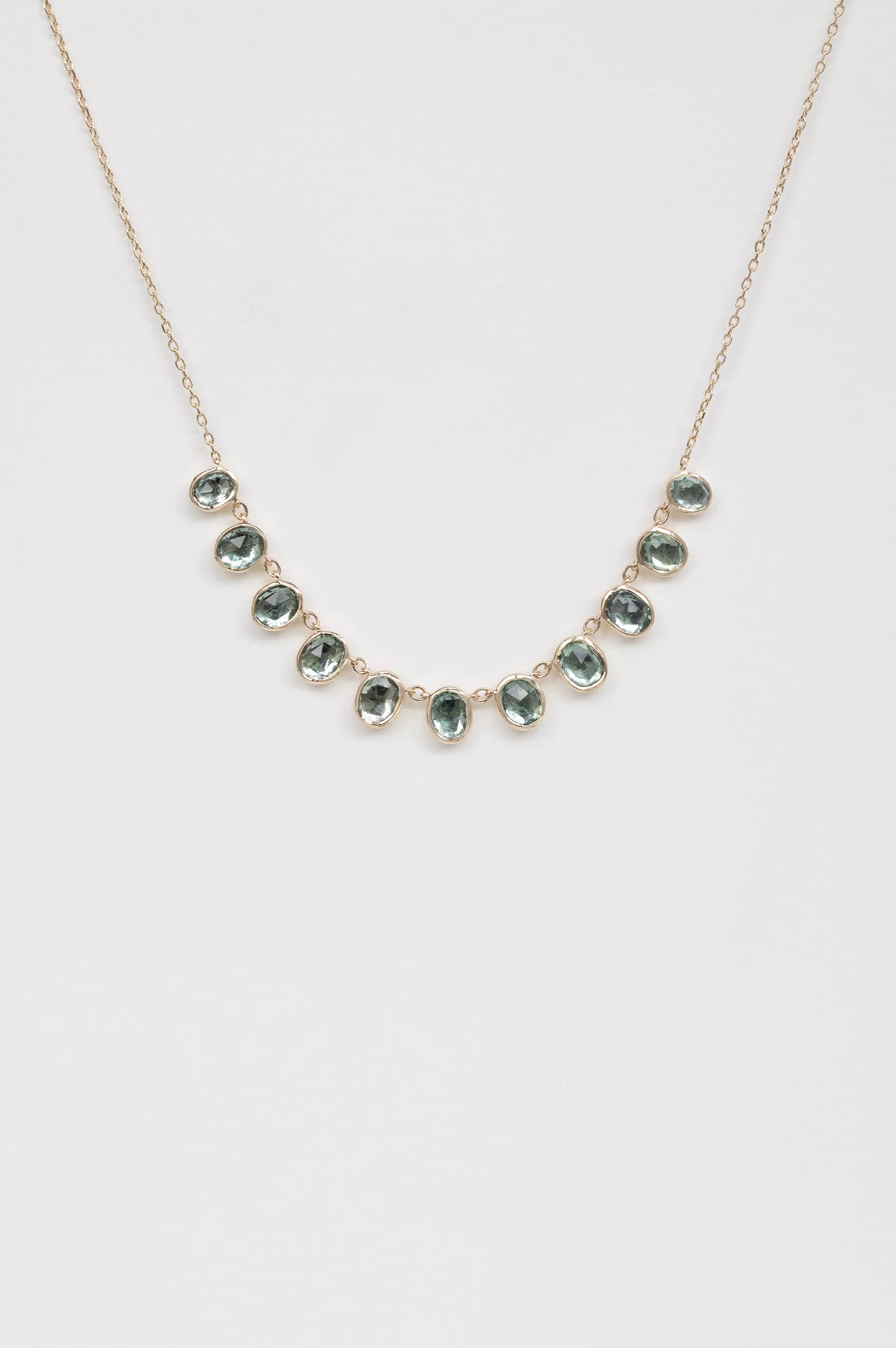 Yellow gold necklace multiple oval blue tourmaline bezel drops curved chain Celine Daoust