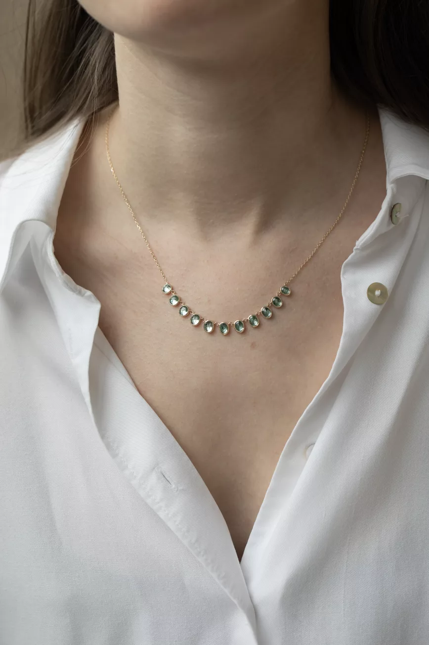 Yellow gold necklace multiple oval blue tourmaline bezel drops curved chain Celine Daoust