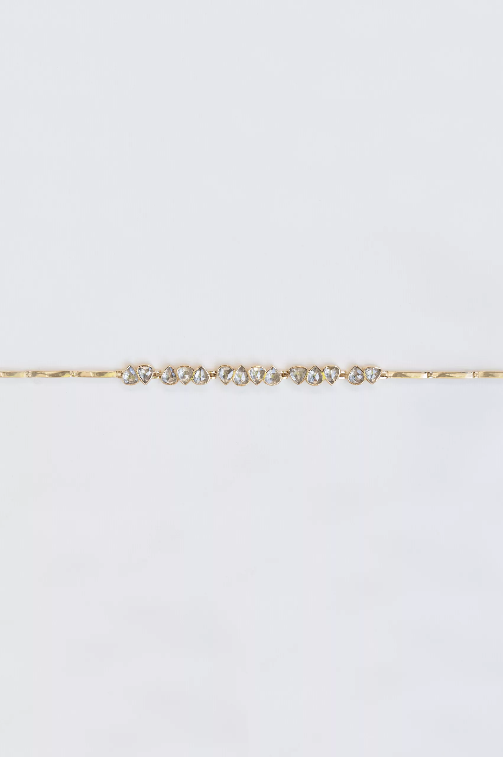 Yellow gold articulated bracelet multiple irregular champagne diamond bezel stations Celine Daoust