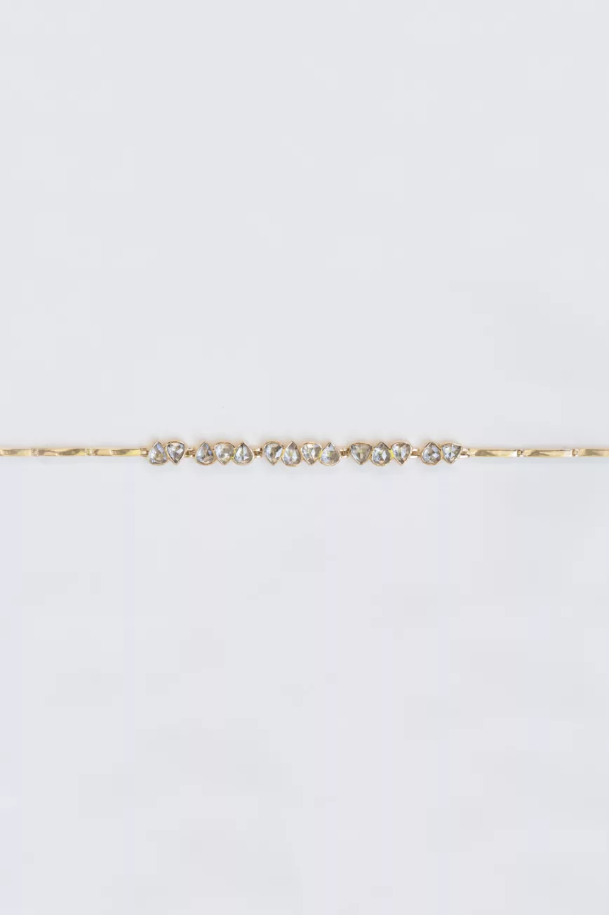 Yellow gold articulated bracelet multiple irregular champagne diamond bezel stations Celine Daoust