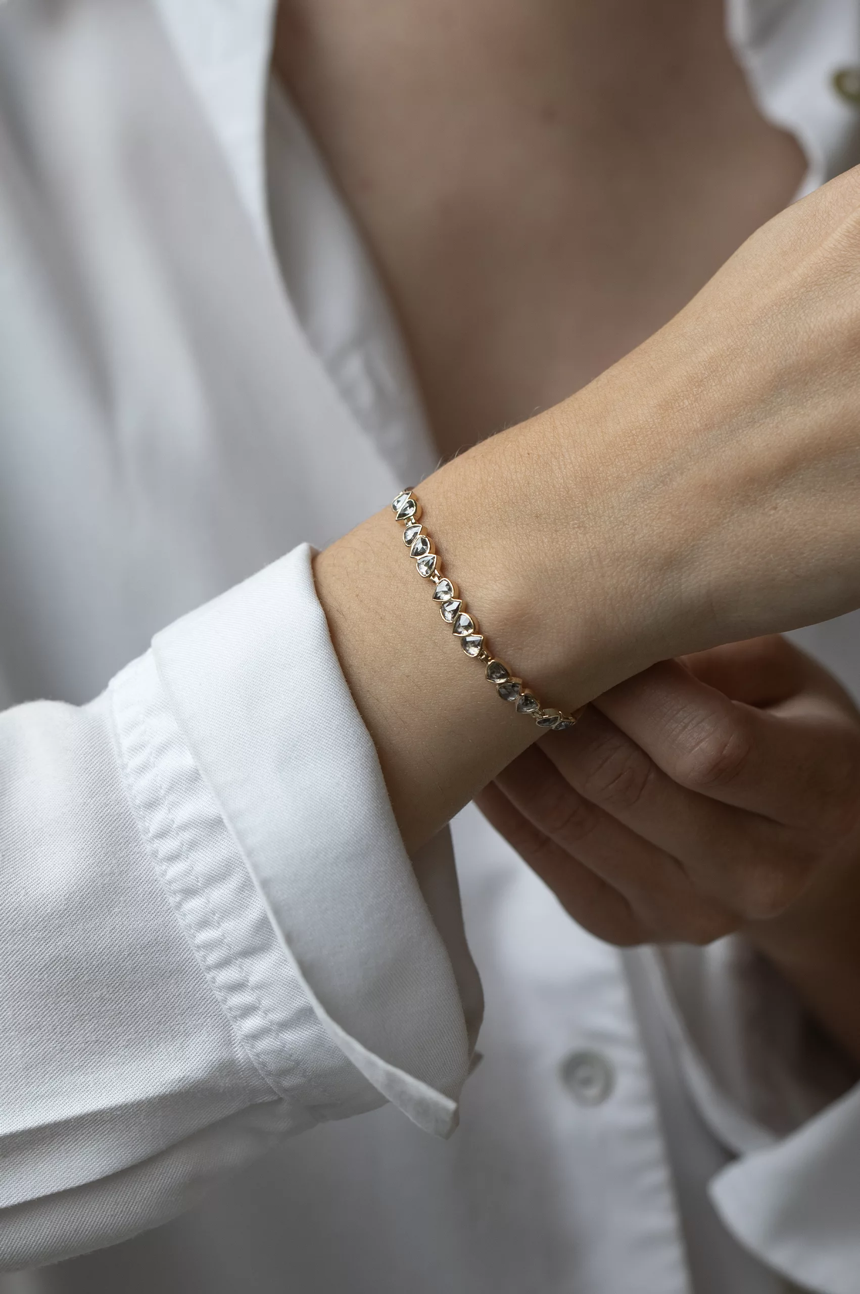 Yellow gold articulated bracelet multiple irregular champagne diamond bezel stations Celine Daoust