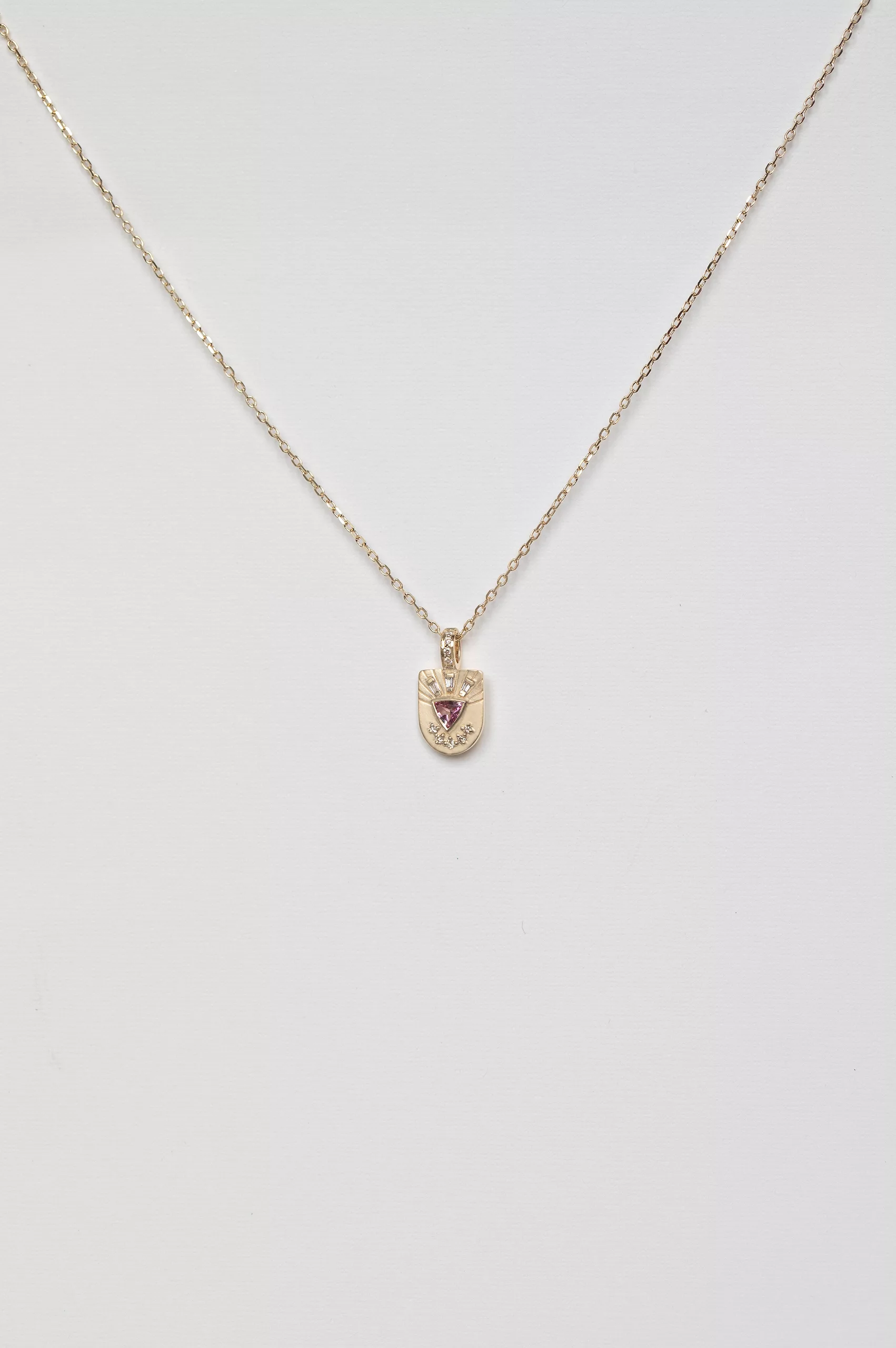 Yellow gold necklace small shield pendant pink tourmaline diamond totem motif Celine Daoust