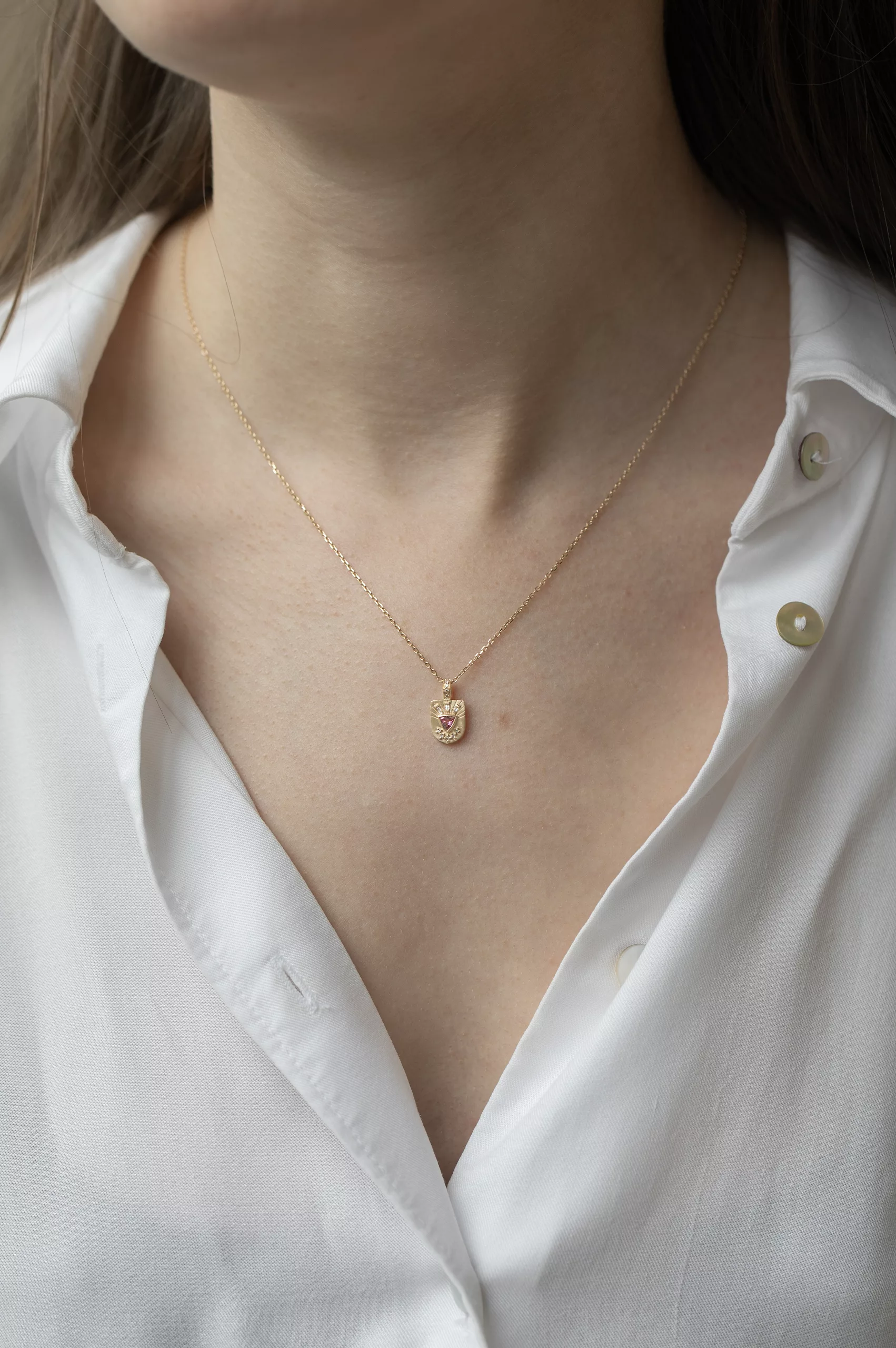 Yellow gold necklace small shield pendant pink tourmaline diamond totem motif Celine Daoust