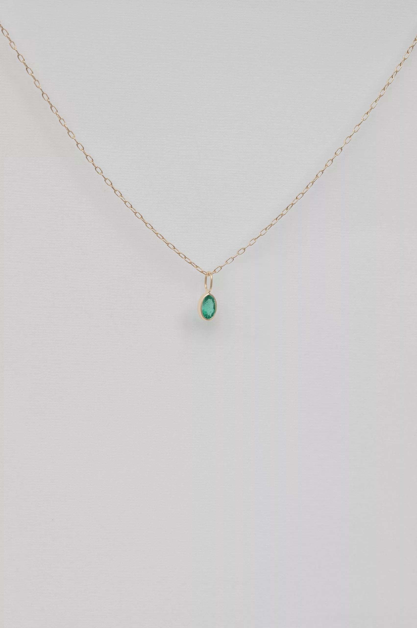 Yellow gold necklace marquise emerald bezel pendant delicate chain Celine Daoust